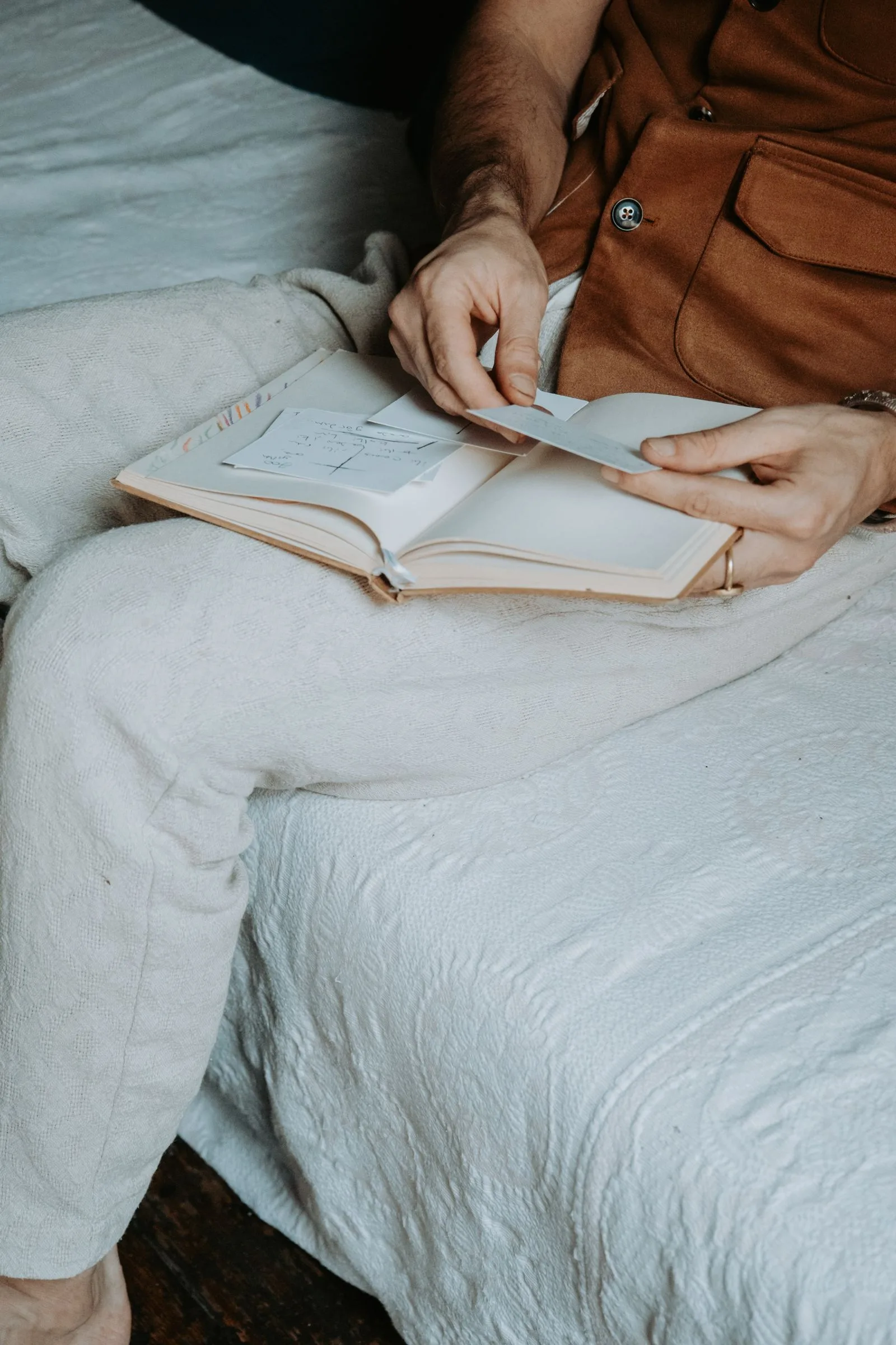 A person journalling quietly at home
