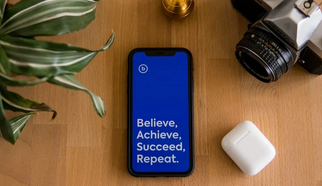Personal Development app and background of a workspace