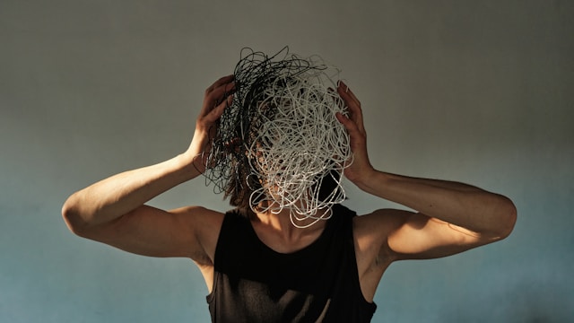 Person showing burnout signs and mental exhaustion from prolonged stress