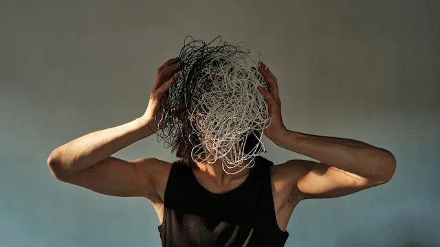Person showing burnout signs and mental exhaustion from prolonged stress