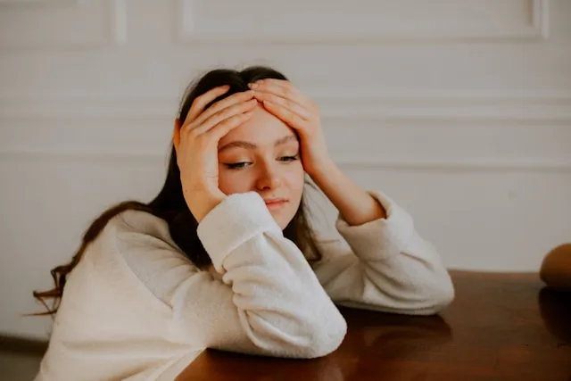 Person using coping mechanisms to manage emotional and mental stress
