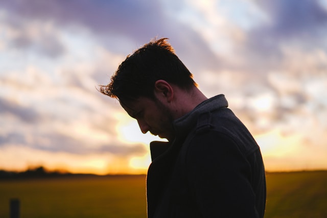 Person coping with grief and learning to live with loss over time