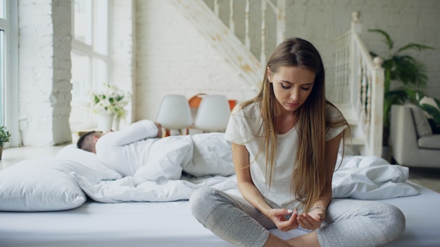 Person experiencing loneliness in relationships despite being together