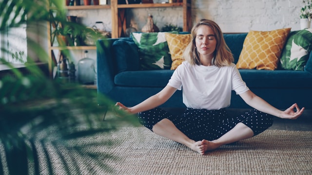 Person practicing mind body healing to restore balance between mental and physical wellbeing
