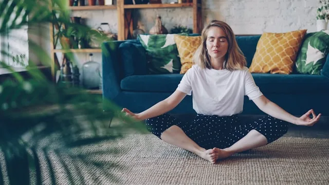 Person practicing mind body healing to restore balance between mental and physical wellbeing