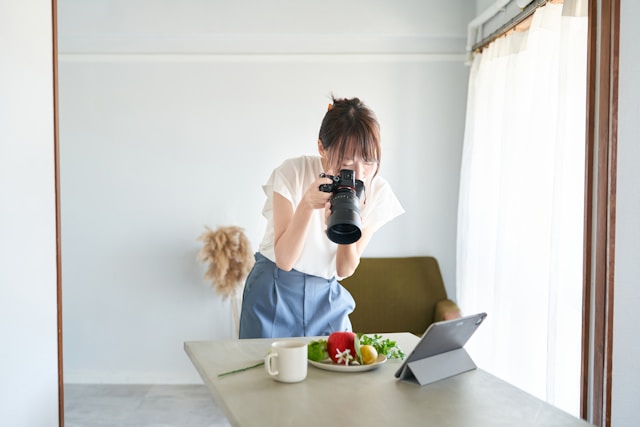 Person practicing photography and capturing moments with focused attention