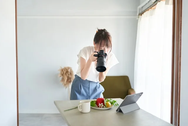 Person practicing photography and capturing moments with focused attention