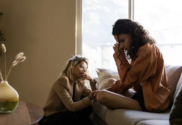 Two people in a moment of real, mutual understanding — the thing an AI can imitate but not provide