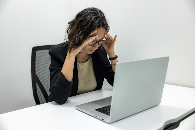 Person experiencing work-related stress and mental overload