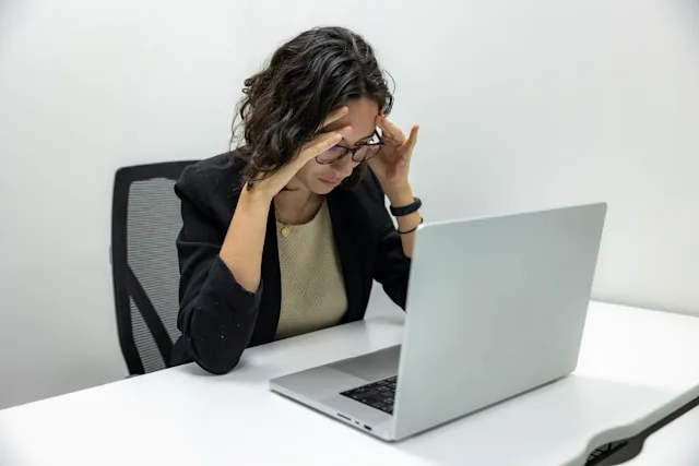 Person experiencing work-related stress and mental overload