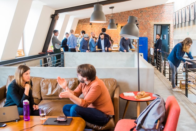 Person working within a workplace culture that influences communication and wellbeing