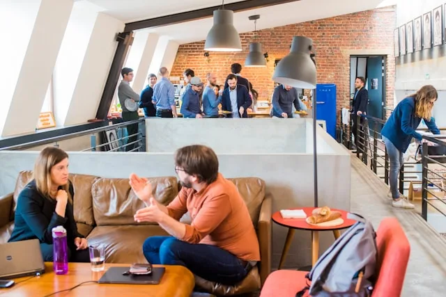 Person working within a workplace culture that influences communication and wellbeing