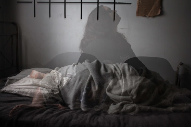 Person suffering from insomnia and chronic sleep difficulties