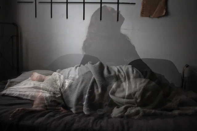 Person suffering from insomnia and chronic sleep difficulties