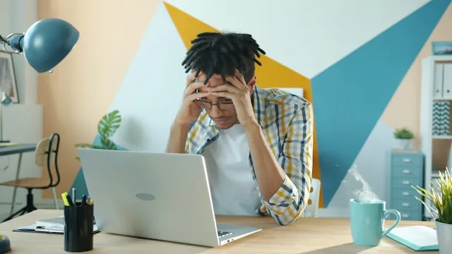 Person sitting alone dealing with anxiety and overthinking thoughts