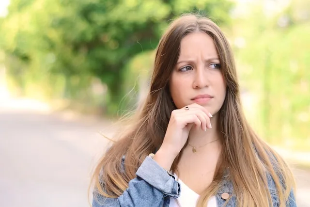 A person deep in thought, unsure where they stand