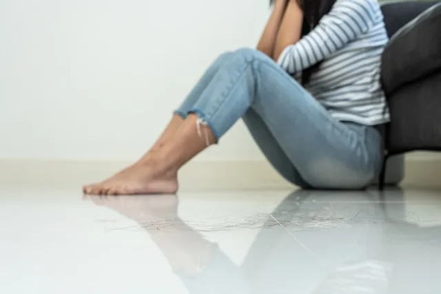 person navigating life after loss and gradually rebuilding meaning and stability