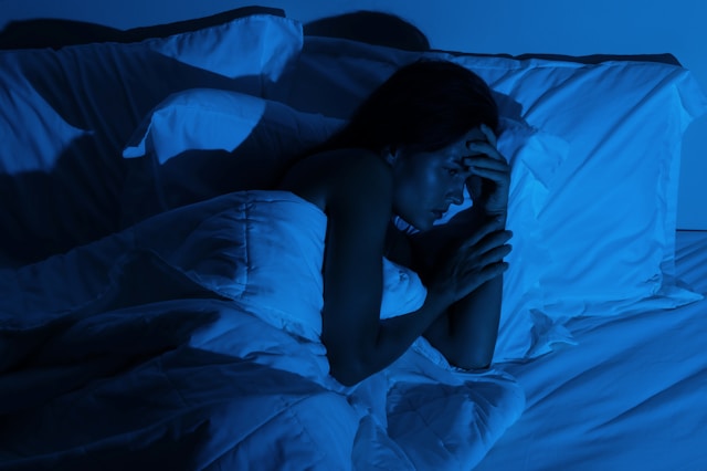 Person experiencing nighttime anxiety and inner unrest