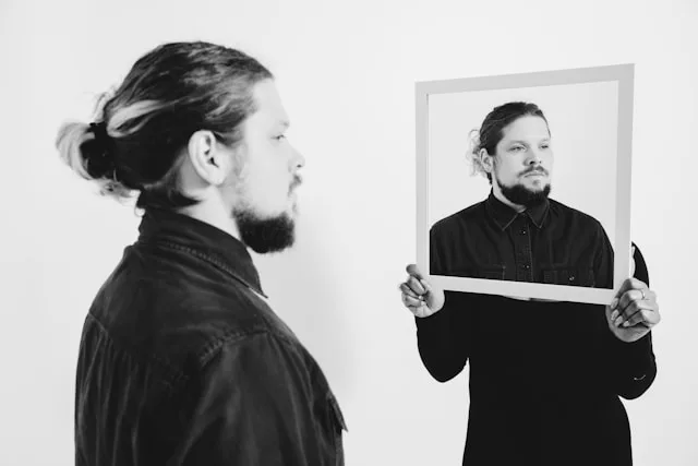 Person reflecting on self image and personal self perception