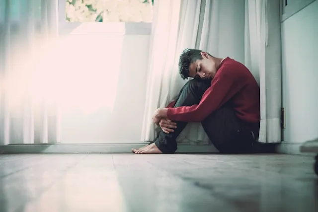 Person experiencing social anxiety while being in a social environment